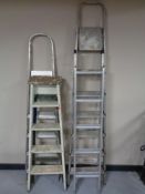 Two pairs of folding steps together with aluminium ladder and wooden steps