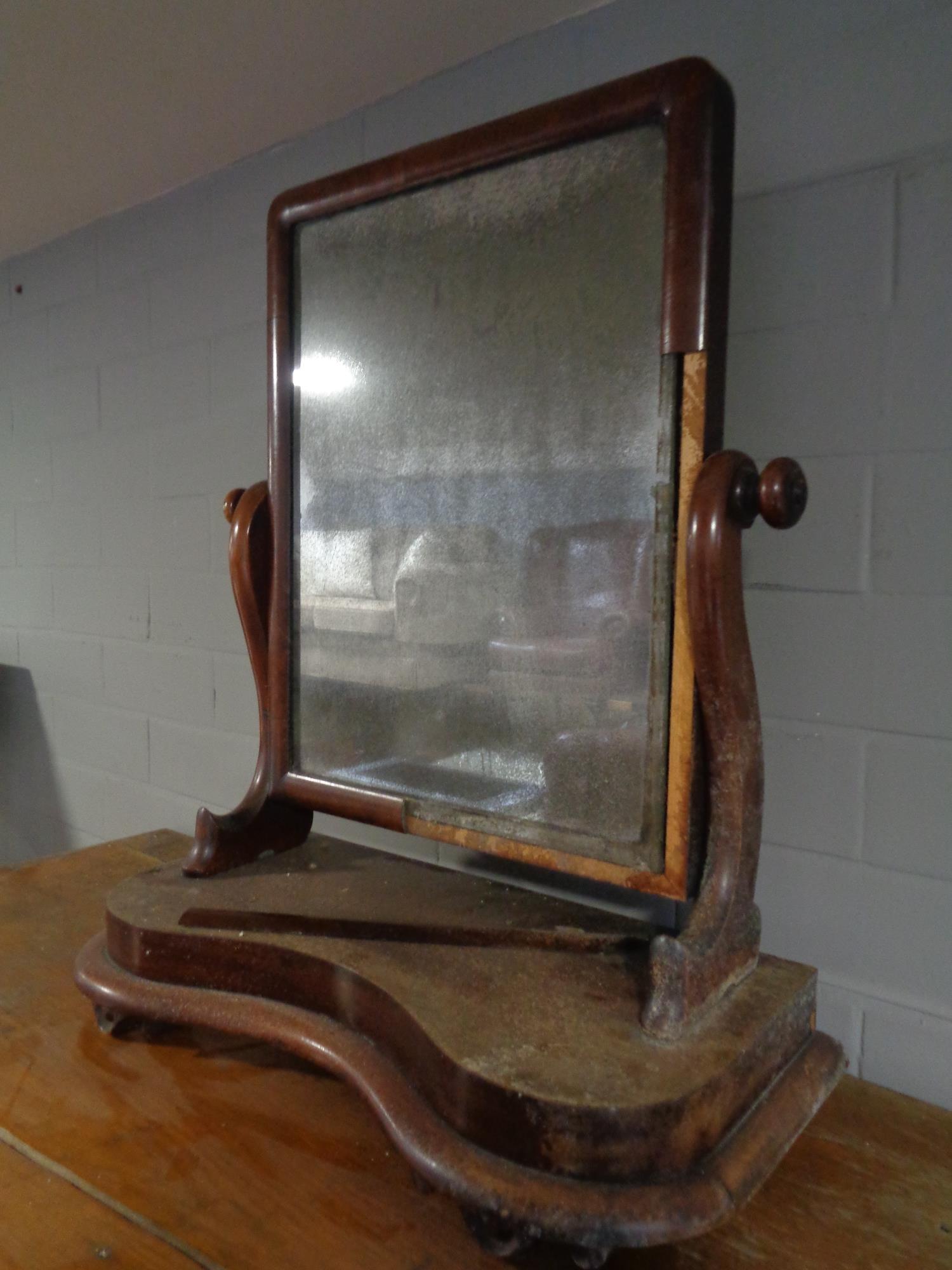 A nineteenth century mahogany toilet mirror