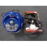 A Polti Vaporetto Sprint steam cleaner with a large quantity of accessories