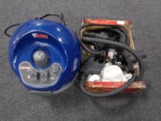 A Polti Vaporetto Sprint steam cleaner with a large quantity of accessories