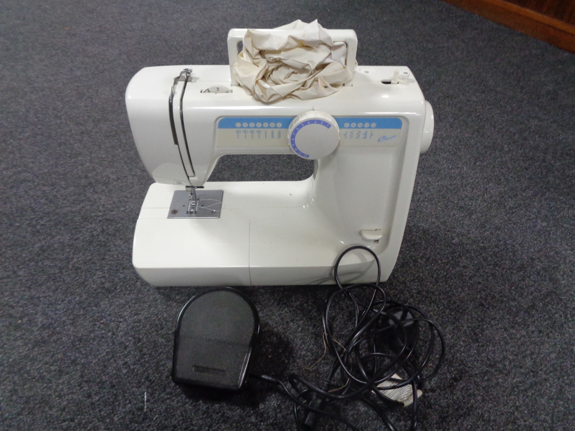 A Classic electric sewing machine with lead.
