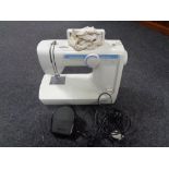 A Classic electric sewing machine with lead.