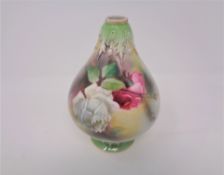 A late 19th century hand painted Royal Worcester bulbous vase, depicting roses,