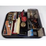 A tray of pipes, table lighters, Calibri and Mintral cased lighters,