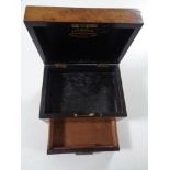 A 19th century walnut homeopathic chemist's box by Davies & Company,