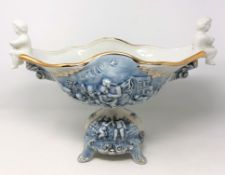 A Capodimonte china comport embossed with cherub decoration