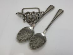 A pair of Victorian silver jam spoons and an ornate silver menu stand (3)