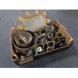 A box containing assorted metal ware to include planters, goblets, brass framed mirror.