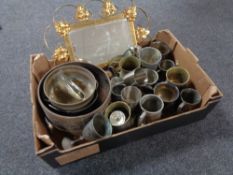 A box containing assorted metal ware to include planters, goblets, brass framed mirror.