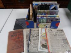A box containing hardback books relating to war and aircraft, images of war magazines etc.