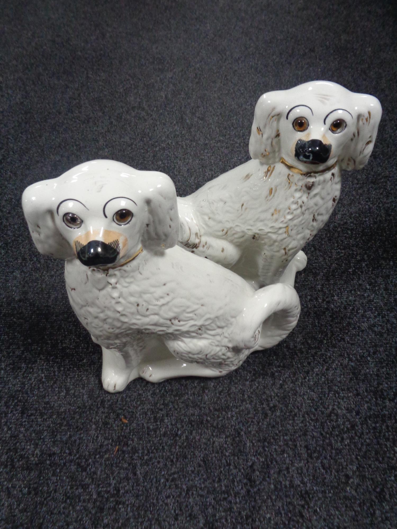 A pair of Staffordshire spaniels with glass eyes