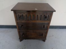 A twentieth century oak three drawer chest