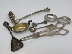 A group of silver and other items including caddy spoon, strainer, salt,