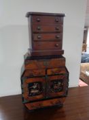 A Japanese Meiji period parquetry table cabinet together with an apprentice five drawer chest