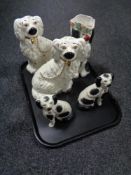 A tray of two pairs of Staffordshire dogs and a Staffordshire dog character jug