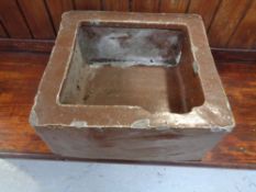 An antique square salt glazed trough, width 35.