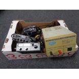 A box containing an Eagle regulated power supply, Harrier CB radio, Marshall micro amp.