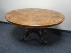 A 19th century inlaid walnut oval pedestal breakfast table.