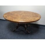 A 19th century inlaid walnut oval pedestal breakfast table.