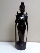 A carved Eastern hardwood figure.