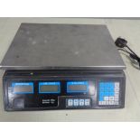 A set of electronic commercial scales.
