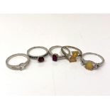 Five silver gem set dress rings.