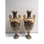 A pair of Japanese twin handled vases depicting geishas, height 43 cm.