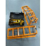 A cased two tonne hydraulic jack together with a set of car ramps.