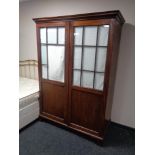 A 19th century mahogany double door hanging wardrobe with glass panel doors (a/f)