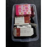 A box containing miscellaneous to include horse blankets, stationary items, door handles etc.