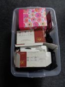 A box containing miscellaneous to include horse blankets, stationary items, door handles etc.