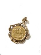 A Victorian gold sovereign 1887 mounted in 9ct gold, 12.7g gross.