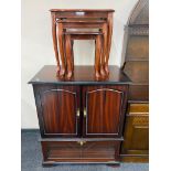 A television cabinet in mahogany finish together with a nest of three tables