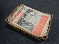 A box containing 1970s Inside Football newspapers.