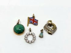 A yellow gold Union Jack enamel charm together with other yellow gold pendants including opal and