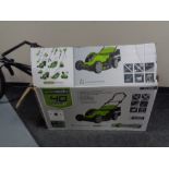 A boxed Green Works 40 volt electric lawn mower with grass box together with a Green Works 40 volt