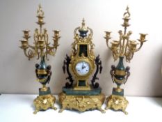 An ornate highly decorative brass and marble three piece Imperial clock garniture.