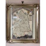 A colour map of Northumberland in decorative frame.