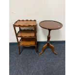 A mahogany three tier occasional stand together with a mahogany wine table