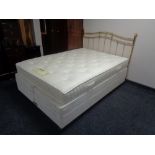 A Dunlopillo Connoisseur 4'6" divan and interior with brass headboard