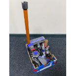 A Dyson V8 hand held vacuum with accessories.