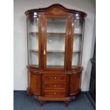 An Italianate display cabinet fitted cupboards and drawers beneath