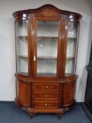 An Italianate display cabinet fitted cupboards and drawers beneath