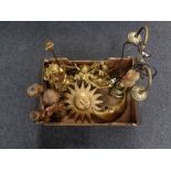 A box containing brass two way light fitting, chalk sun and moon ornaments, cherub table lamp etc.