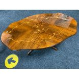 An Italianate shaped pedestal coffee table