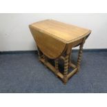 An oak barley twist gate leg table.