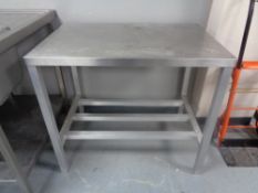 A stainless steel two tier prep table, width 91.5 cm.