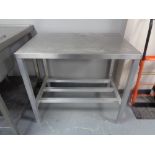 A stainless steel two tier prep table, width 91.5 cm.