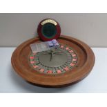 A roulette wheel with accessories.