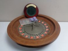 A roulette wheel with accessories.